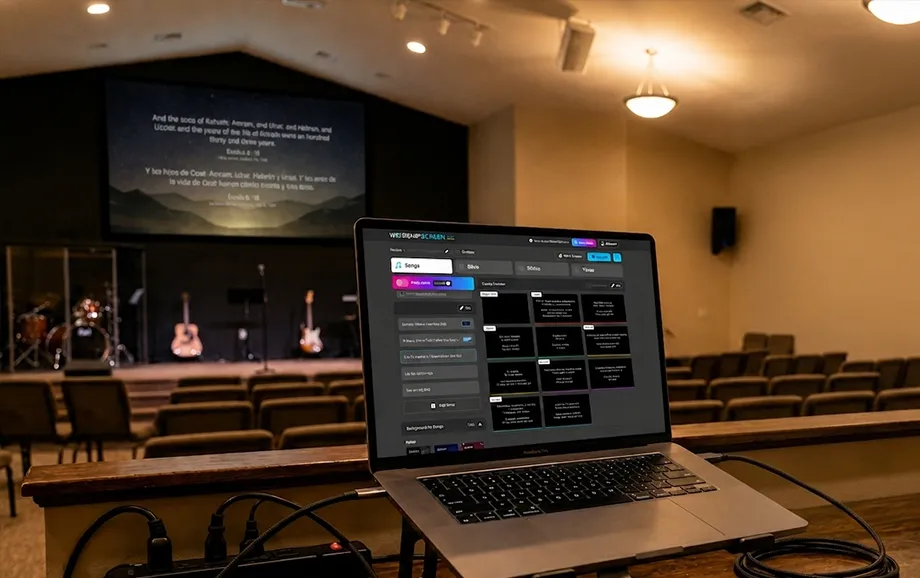 Laptop with WorshipScreen song slides and a Bible passage projected in the church